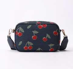CAMERA-CHERRY-BLUE | Cherry Camera Crossbody Bag On Blue Backdrop