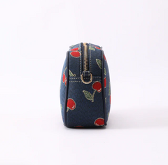CAMERA-CHERRY-BLUE | Cherry Camera Crossbody Bag On Blue Backdrop